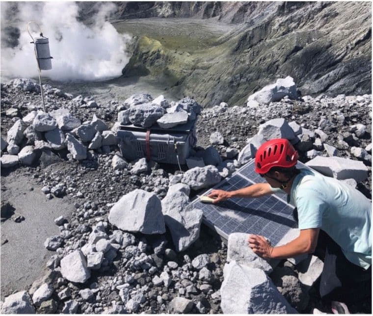 Avard cleaning ash from the solar panels at the MultiGAS site on the western crater rim.